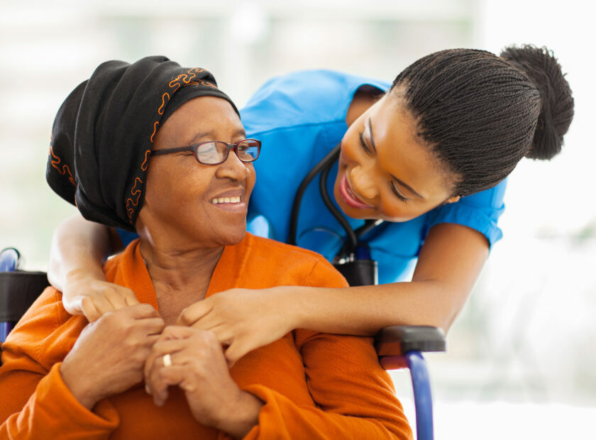 african senior patient with female nurse