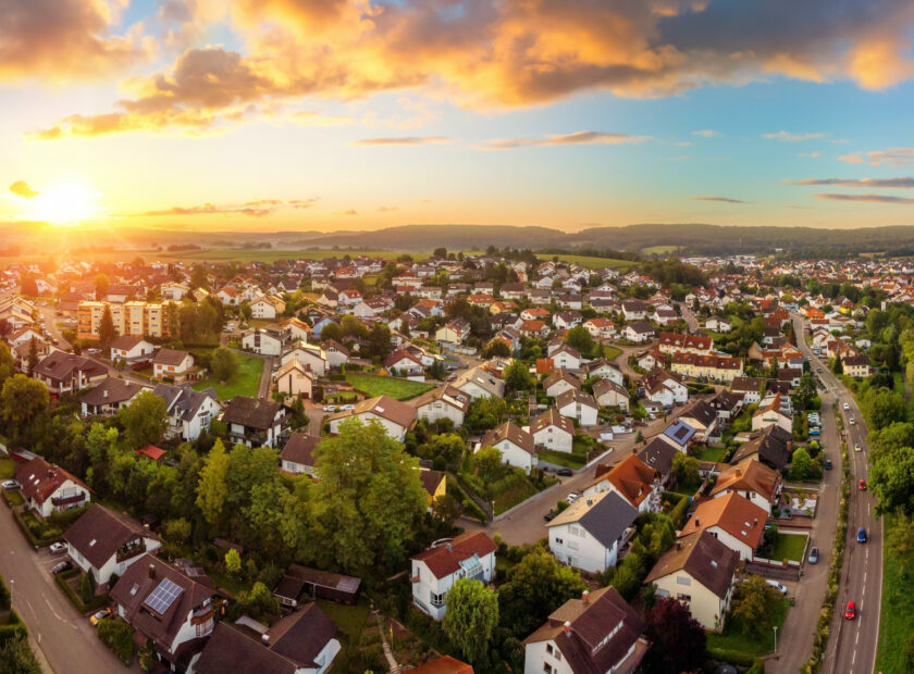 Aerial panorama of small town at sunrise