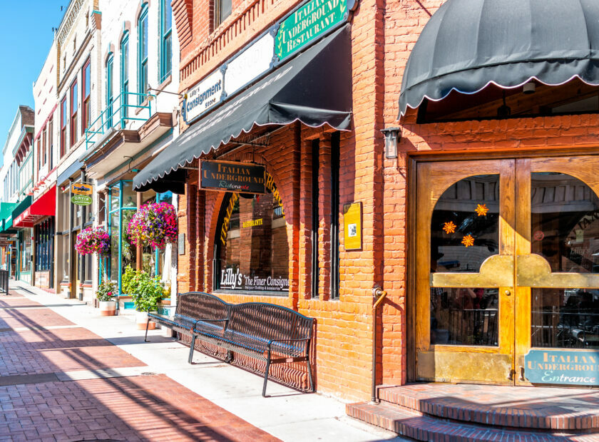Glenwood Springs, USA – July 10, 2019: Historic street sidewalk in Colorado on Grand Avenue and Italian restaurant