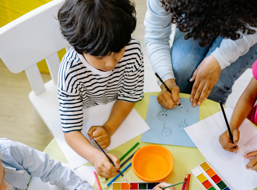 child coloring in daycare setting